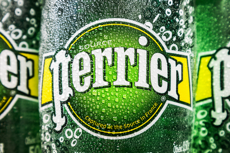 Moscow, Russia - March 28, 2019: logo on mineral water bottles Perrier. Perrier is a French brand of premium mineral water, bottled from springs in the vicinity of verges In the South of Franceのeditorial素材