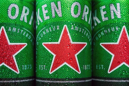 Moscow, Russia - March 28, 2019: logo on aluminum cans of Heineken beer. Heineken Dutch brewing...