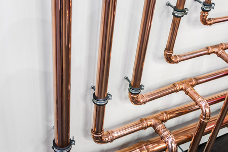 copper pipes and fittings for carrying out plumbing work. Plumbing, fixing pipes and fittings for connection of water or gas systemsの写真素材