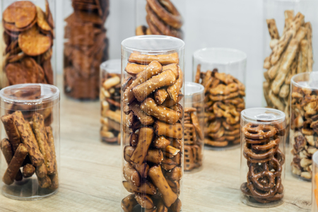 cookies, crackers, crackers and other snacks in boxes on the counter of the store