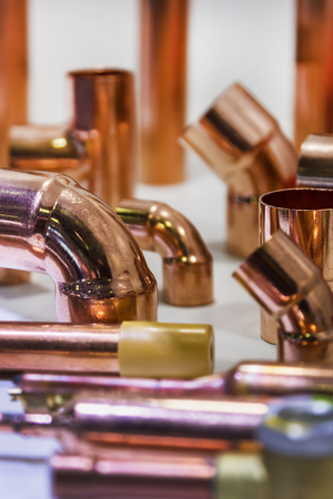 copper pipes and pipes for construction and plumbing works. Copper tube backgroundの写真素材