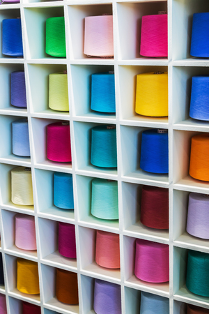 different colors of thread, textile, for clothing manufacture or in the shopの写真素材