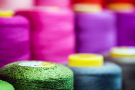different colors of thread, textile, for clothing manufacture or in the shopの写真素材