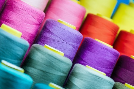 different colors of thread, textile, for clothing manufacture or in the shopの写真素材