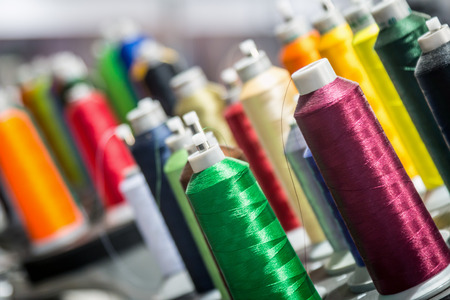 different colors of thread, textile, for clothing manufacture or in the shopの写真素材