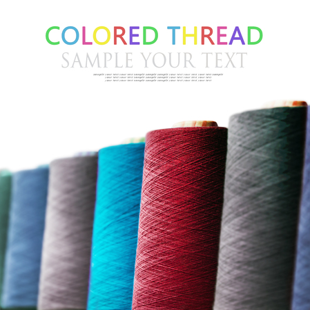different colors of thread, textile, for clothing manufacture isolated on white background. Text deleteの写真素材