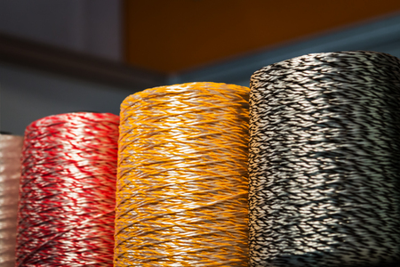 different colors of thread, textile, for clothing manufacture or in the shopの写真素材