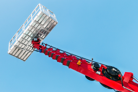 boom and basket of telescopic aerial platform for construction and repair worksの写真素材