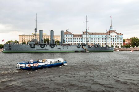 Saint Petersburg, RUSSIA - June 22, 2019: Ancient cruiser Aurora at the pier on the Neva river. Tourists and people visiting the cruiserのeditorial素材