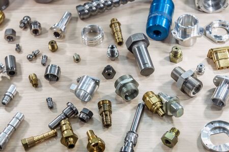 background of different metal products for metal working: cutters, connectors, nuts, fittings, fasteners, etc.の写真素材