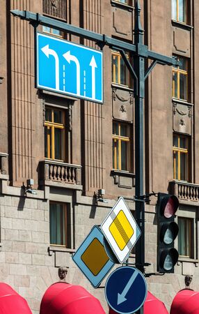 various road signs and traffic lights in the big cityの写真素材