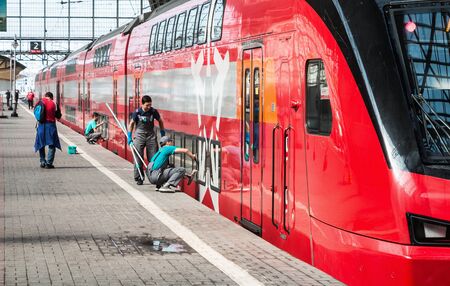 Moscow, Russia - August 8, 2019: cleaning company workers are preparing a high-speed train for a trip to the kievsky station in Moscow.のeditorial素材