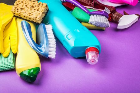 various cleaning products for the house on a colored background.