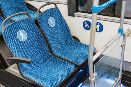 modern city bus or bus with seats for the disabled, the elderly, dogs and mothers with childrenの写真素材