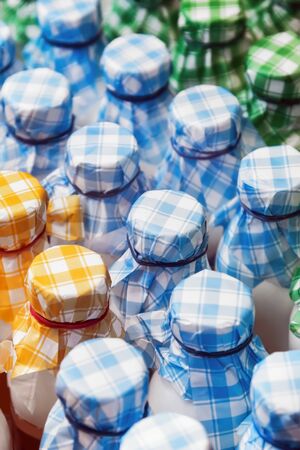 plastic bottles with colorful beverage lids. Shallow depth of fieldの写真素材