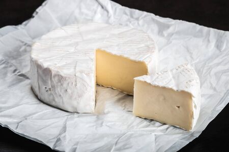brie cheese on a plate on the tableの写真素材