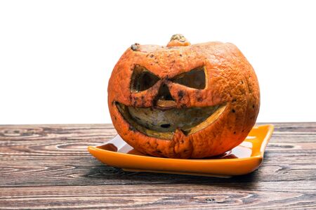 pumpkin lantern Jack-rotten to the holiday of Halloween. Very scary pumpkin isolated on white backgroundの写真素材