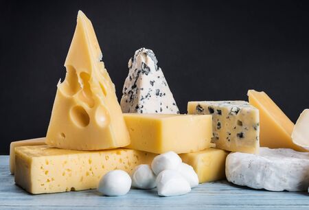 different varieties and types of cheese are on the tableの写真素材