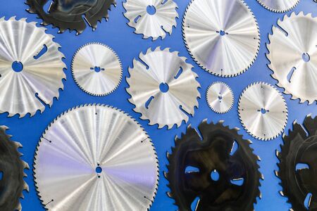 sawmill cutting discs hang as a pattern on the wallの写真素材