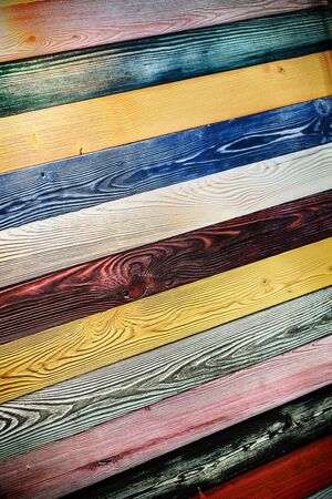 wooden background of boards of different colors and textures of woodの写真素材