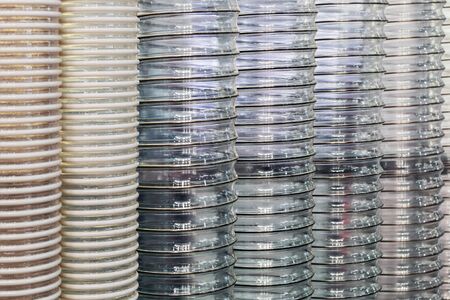 corrugated transparent plastic pipe with metal frame backgroundの写真素材