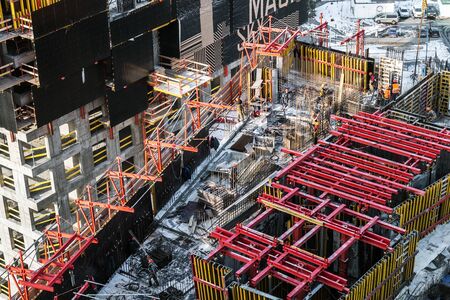Moscow, Russia-March 2, 2019: builders work at a construction site. Construction of a residential...