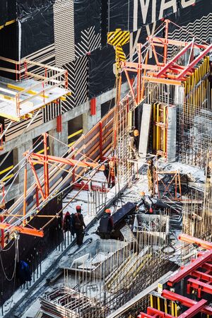 Moscow, Russia-March 2, 2019: builders work at a construction site. Construction of a residential building in Moscowのeditorial素材