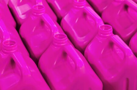 plastic cans of light purple color in the warehouse, production, factory. Background from plastic canistersの写真素材