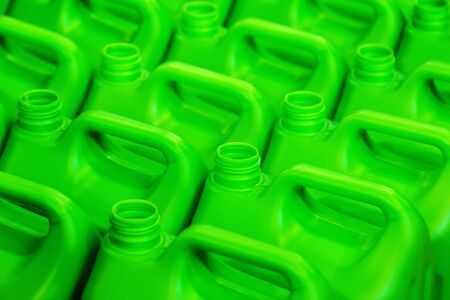 plastic canisters of light green color in the warehouse, production, factory. Background from plastic canistersの写真素材
