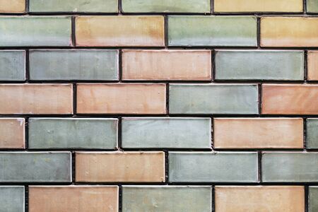 brickwork of different colors of bricks. The background of bricksの写真素材