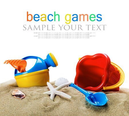 children's toys, bucket, shovel and race on the sea sand isolated on white background. Text deleteの写真素材