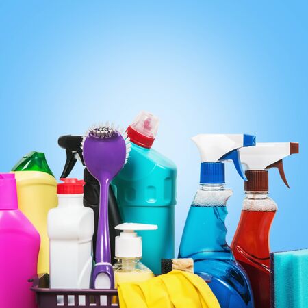 assortment of cleaning products on a blue background . Different tools for cleaning the apartmentの写真素材