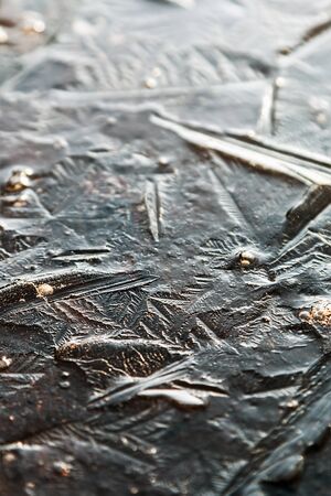 background from the structure of the frozen ice of a winter lake or pond.の写真素材