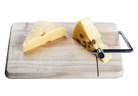 Maasdam cheese is cut into slices isolated on a white backgroundの写真素材