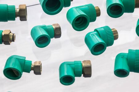 metal-plastic fittings, water taps and various connections on the standの写真素材