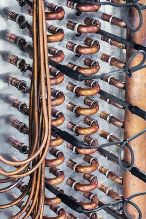copper tubes in the cooling system of climate equipment. copper pipes for connectionの写真素材