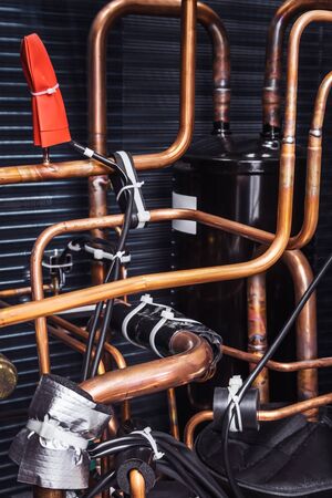 copper tubes in the cooling system of climate equipment. copper pipes for connectionの写真素材