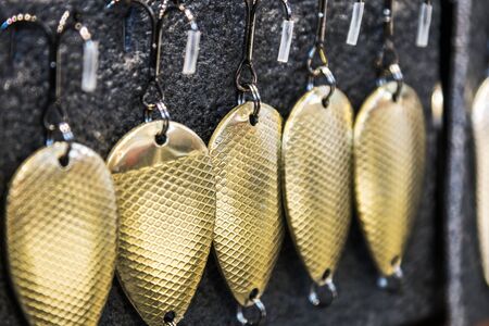 metal wavering fishing lures of gold color for spinning fishingの写真素材