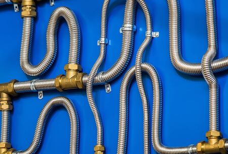 corrugated steel tubes and copper tees and adapters for connection. Sample wiring in the cooling system of climate equipmentの写真素材