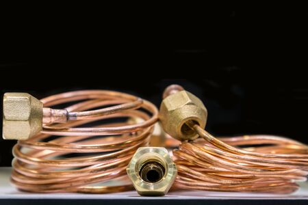 copper tube is rolled up for connection, the background is copperの写真素材