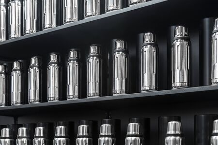 metal bottles are a lot on the store counterの写真素材