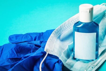 personal protective equipment against covid-19 coronavirus. Antiseptic hand liquid, face mask and...