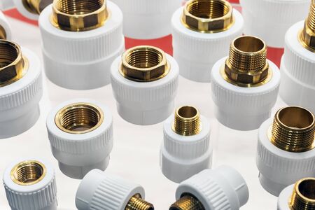 metal-plastic parts of pipes, connection adapters for ventilation and air conditioning systems and plumbingの写真素材