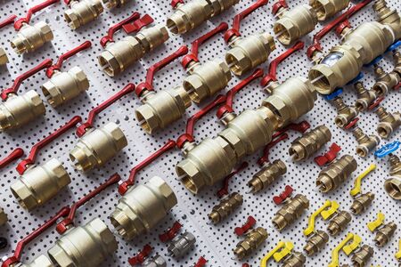 many different water ball valves for plumbing or gas worksの写真素材