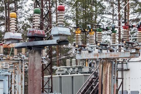 an old power plant with rusty wires, structures, and equipment