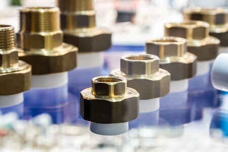 metal-plastic parts of pipes, connection adapters for ventilation and air conditioning systems and plumbingの写真素材