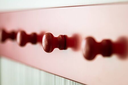 red wooden hanger on the wall. Low depth of fieldの写真素材