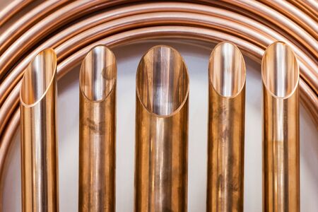 background of copper pipes for plumbing and climate engineering. Selective focusの写真素材