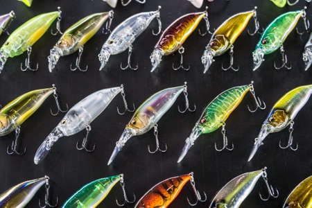 Moscow, Russia-February 20, 2020: 47 international exhibition hunting and FISHING in RUSSIA. fishing wobblers and baubles of different colors and sizes in the exhibition window.のeditorial素材