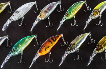 Moscow, Russia-February 20, 2020: 47 international exhibition hunting and FISHING in RUSSIA. fishing wobblers and baubles of different colors and sizes in the exhibition window.のeditorial素材